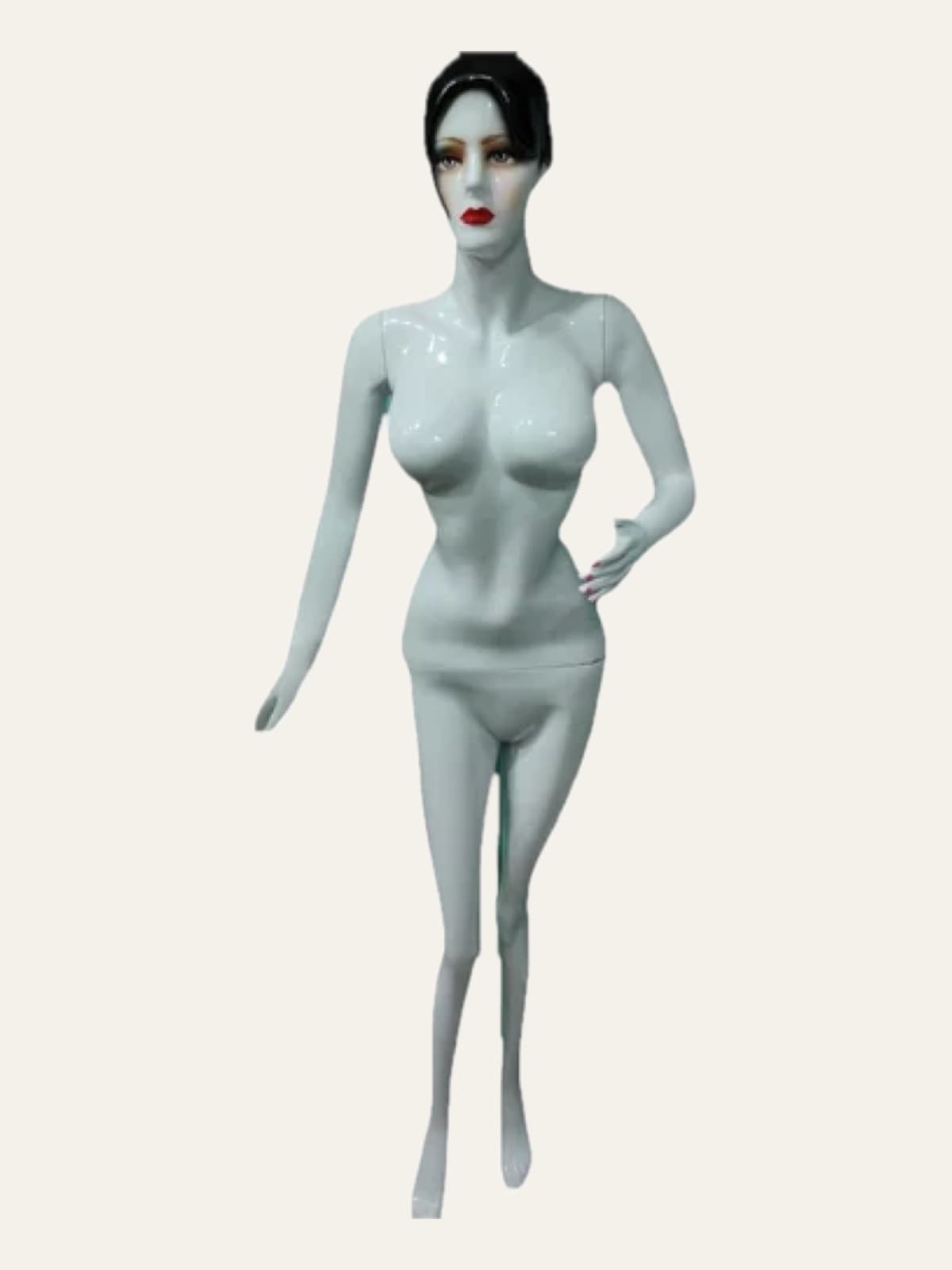 Female mannequin with painted makeup and dark moulded hair, full length