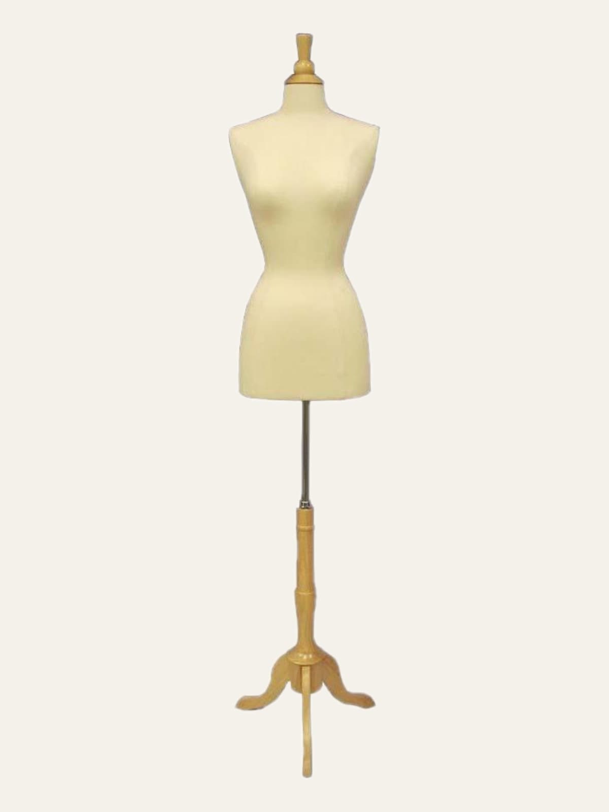Cream female dress form on a wooden tripod stand